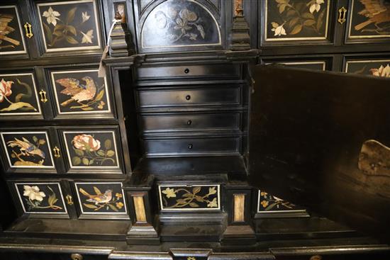 A 17th/18th century Italian and later pietra dura and ebony veneered cabinet on an ebonised wood stand, W.4ft 2in. D.1ft 7in. H.4ft 6.5